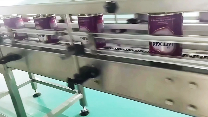 Transportador de cadena para enfriamiento de cuerpos de lata de leche en polvo